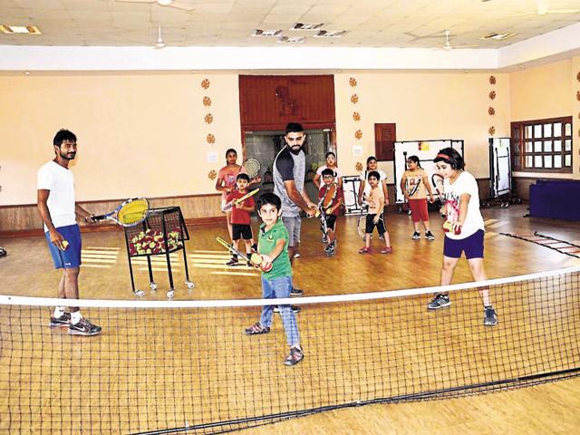 Catching them young! Children getting trained in lawn tennis at The Gurukul, Panchkula, during extended school hours. (HT Photo) Catching them young! Children getting trained in lawn tennis at The Gurukul, Panchkula, during extended school hours. (HT Photo)