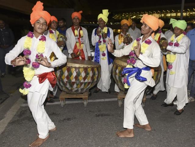 Folk dancers perform during a welcome ceremony for Deepa Malik. (Sonu Mehta/HT PHOTO)