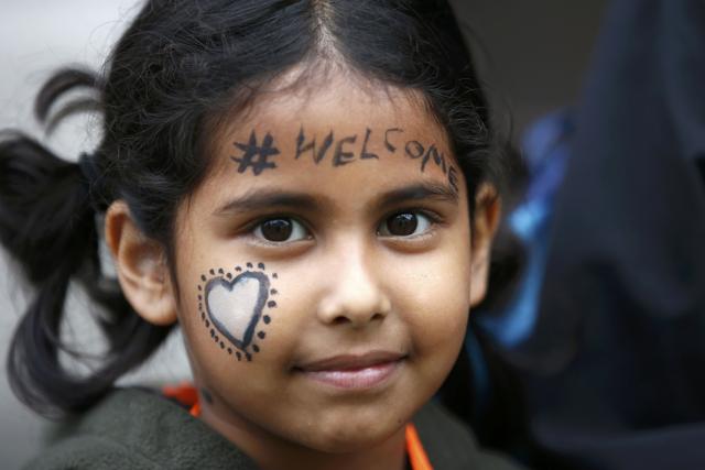 A demonstrator marches to the Houses of Parliament. (REUTERS)