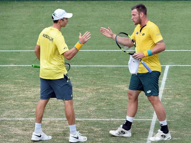 Australia's John Peers, left, and Sam Groth whisper tactics during their Davis Cup World Group playoff. (AP Photo) Australia's John Peers, left, and Sam Groth whisper tactics during their Davis Cup World Group playoff. (AP Photo)