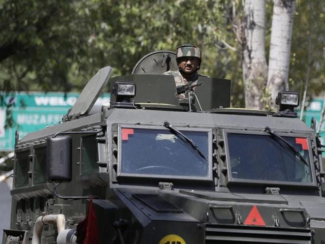 An army soldier guards the army base which was attacked in Uri on Sunday. (PTI Photo) An army soldier guards the army base which was attacked in Uri on Sunday. (PTI Photo)