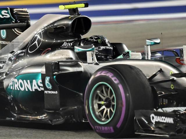 Nico Rosberg celebrates his win as Lewis Hamilton, right, and Daniel Ricciardo, left, look on. (REUTERS) Nico Rosberg celebrates his win as Lewis Hamilton, right, and Daniel Ricciardo, left, look on. (REUTERS)