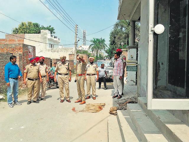Police investigating the crime scene in Malerkotla on Saturday. (HT Photo) Police investigating the crime scene in Malerkotla on Saturday. (HT Photo)