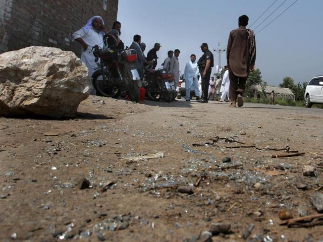 Pakistani police officers and local residents gather at the site of firing incident at Garhi Sohbat Khan on the outskirts of Peshawar, Pakistan. Two gunmen on a motorcycle killed three soldiers Sunday, police said. (AP Photo) Pakistani police officers and local residents gather at the site of firing incident at Garhi Sohbat Khan on the outskirts of Peshawar, Pakistan. Two gunmen on a motorcycle killed three soldiers Sunday, police said. (AP Photo)