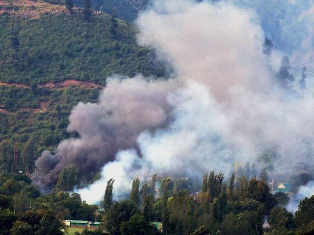 Smoke rises from an Indian Army Brigade camp during a terror attack in Uri, Jammu and Kashmir on Sunday.(PTI Photo)