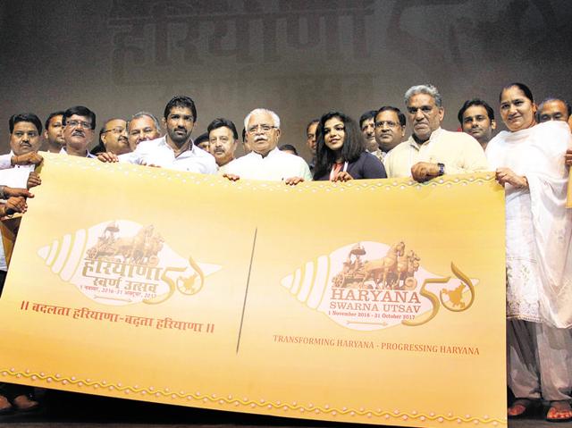 CM Manohar Lal Khattar (centre) flanked by wrestlers and Olympic medallists Yogeshwar Dutt and Sakshi Malik, at the unveiling of the logo of Haryana golden jubilee celebrations on Saturday. (HT Photo) CM Manohar Lal Khattar (centre) flanked by wrestlers and Olympic medallists Yogeshwar Dutt and Sakshi Malik, at the unveiling of the logo of Haryana golden jubilee celebrations on Saturday. (HT Photo)