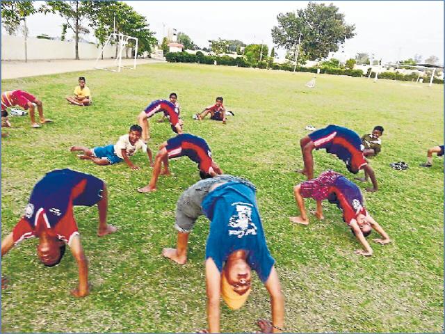 Youth exercising on the playground. (HT Photo) Youth exercising on the playground. (HT Photo)