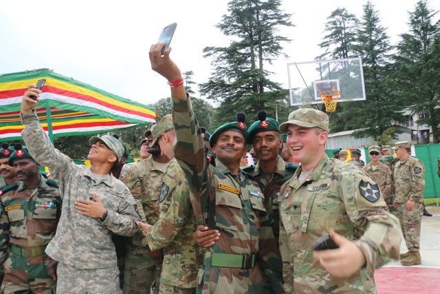 American and Indian Army soldiers click selfies at Chaubatia in Uttarakhand. (Rajeev Kala/HT Photo)