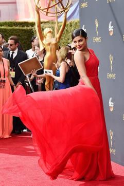 Priyanka spun and smiled for photographers in her red Jason Wu dress, with cutouts on the shoulder and waist. (Reuters)