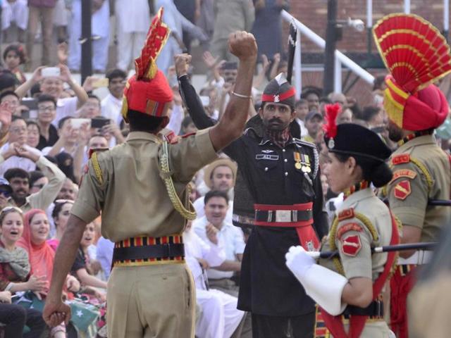 The BSF jawans stomped harder and swung their arms more assertively as they marched up to the Rangers. (Sameer Sehgal/HT Photo)