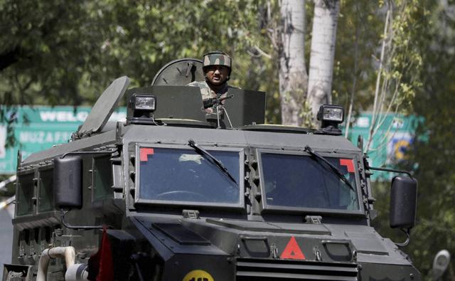 A soldier guards the army base which was attacked by militants in Uri, Jammu and Kashmir. (PTI Photo)