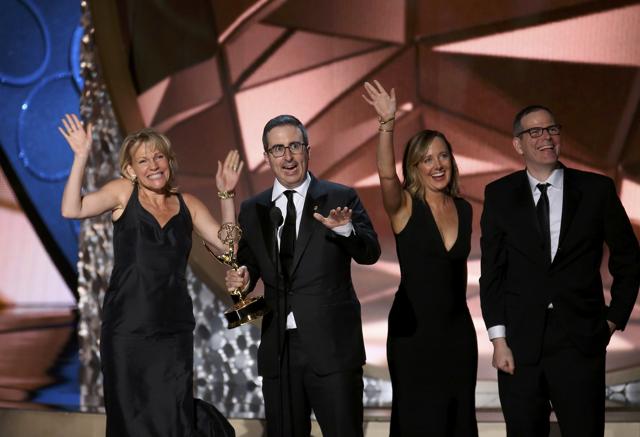 John Oliver (2nd from L) accepts the award for Outstanding Variety Talk Series for Last Week Tonight With John Oliver at the 68th Primetime Emmy Awards in Los Angeles, California. (REUTERS) John Oliver (2nd from L) accepts the award for Outstanding Variety Talk Series for Last Week Tonight With John Oliver at the 68th Primetime Emmy Awards in Los Angeles, California. (REUTERS)