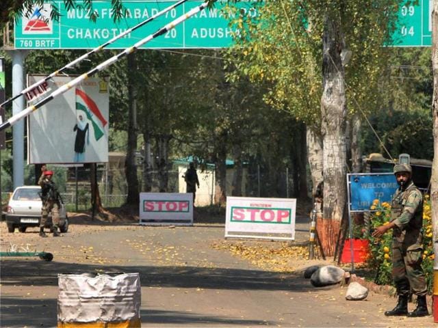 Soldiers guard the army base which was attacked by militants in Uri, on Monday.(PTI)