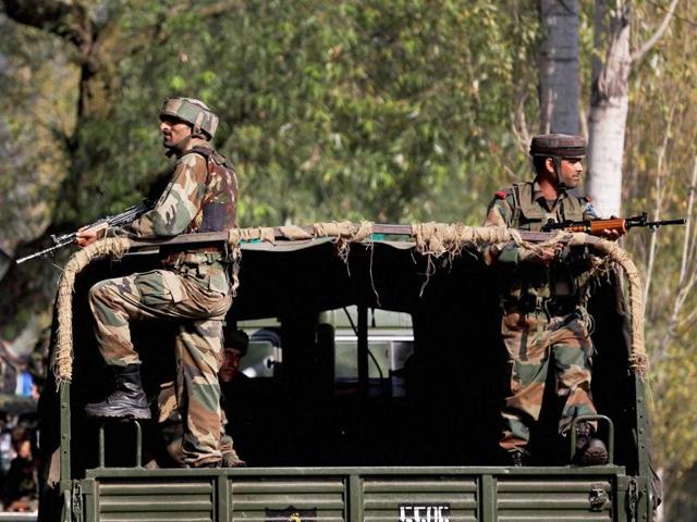 Soldiers stand guard outside the army base which was attacked by militants in Uri. (PTI) Soldiers stand guard outside the army base which was attacked by militants in Uri. (PTI)