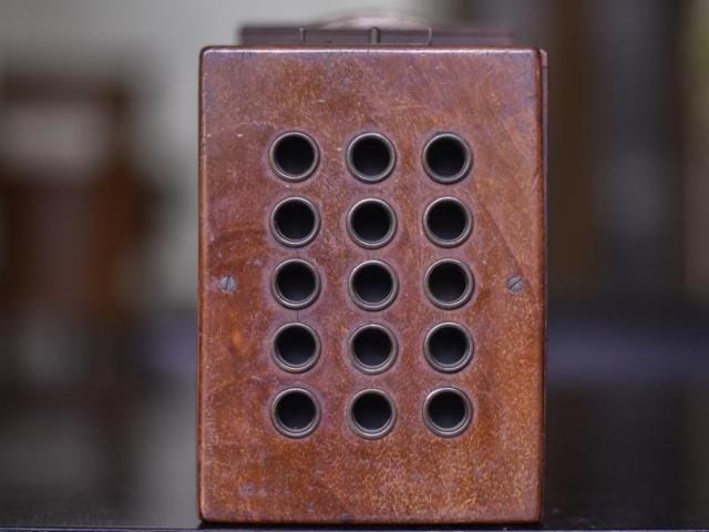 A 1906 vintage Royal mail stamp camera made of wood and brass. The camera consisted of 15 individual lenses capable of taking 15 postage stamp size images. Multiplying cameras were created as a cost-effective way to duplicate images in one go. (Kunal Patil/Hindustan Times)