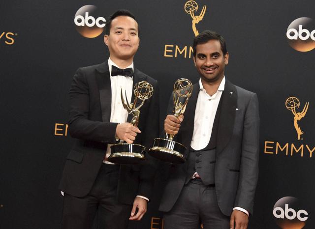 Los Angeles : Aziz Ansari, right, and Kelvin Yu winners of the award for outstanding writing for a comedy series for Master of None. (AP) Los Angeles : Aziz Ansari, right, and Kelvin Yu winners of the award for outstanding writing for a comedy series for Master of None. (AP)