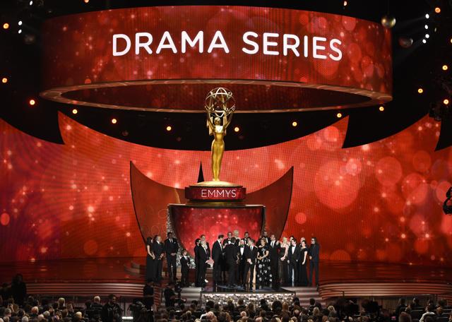 The cast and crew from “Game of Thrones” accept the award for outstanding drama series at the 68th Primetime Emmy Awards on Sunday, Sept. 18, 2016, at the Microsoft Theater in Los Angeles. (Photo by Chris Pizzello/Invision/AP) (Chris Pizzello/Invision/AP)