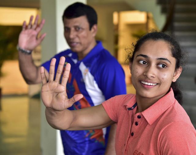 New Delhi: Dipa Karmakar (R), who missed out on an Olympic medal by 0.150 points in Vaults final, with coach Bishweshwar Nandi at IG Stadium in New Delhi on Saturday. PTI Photo by Kamal Kishore (PTI8_20_2016_000089A) (PTI) New Delhi: Dipa Karmakar (R), who missed out on an Olympic medal by 0.150 points in Vaults final, with coach Bishweshwar Nandi at IG Stadium in New Delhi on Saturday. PTI Photo by Kamal Kishore (PTI8_20_2016_000089A) (PTI)