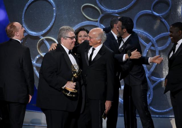 Executive Producer David Mandel (L) is embraced by presenter Larry David as he accepts the award for Outstanding Comedy Series for Veep at the 68th Primetime Emmy Awards in Los Angeles, California, U.S., September 18. (REUTERS) Executive Producer David Mandel (L) is embraced by presenter Larry David as he accepts the award for Outstanding Comedy Series for Veep at the 68th Primetime Emmy Awards in Los Angeles, California, U.S., September 18. (REUTERS)