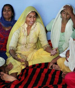 Wife of Havildar Ravi Paul who was martyred in Sunday's terrorist attack at Uri Army camp, at her native village Sarwa in Samba on Monday. (PTI)