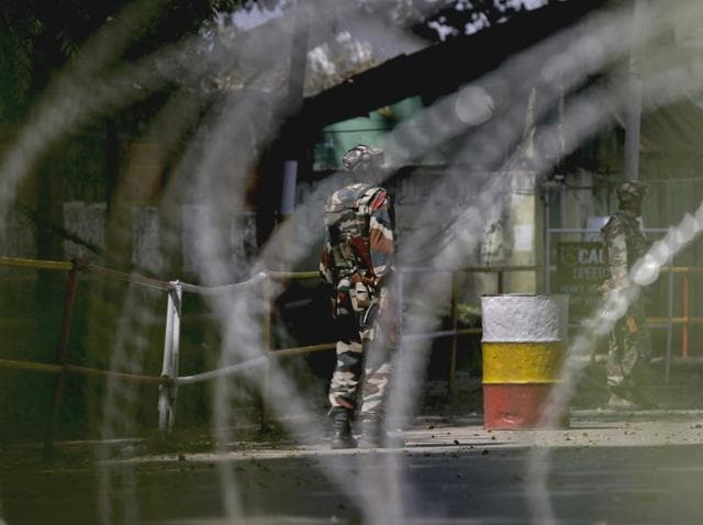 Army personnel in action inside the army brigade camp during a terror attack in Uri, Jammu and Kashmir.(PTI Photo)