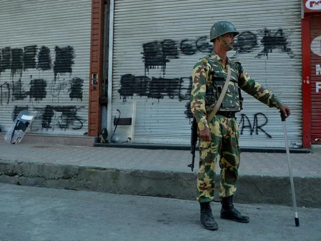 A trooper stands guard during a curfew in the Lal Chowk area of central Srinagar .(AFP File)
