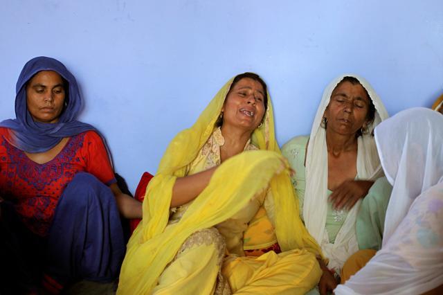 Geeta Rani (in yellow), wife of Ravi Paul who was killed in Sunday's attack at an army base in Kashmir's Uri, mourns at her house in Sarwa village in Samba district. (REUTERS) Geeta Rani (in yellow), wife of Ravi Paul who was killed in Sunday's attack at an army base in Kashmir's Uri, mourns at her house in Sarwa village in Samba district. (REUTERS)