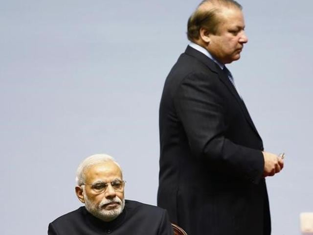 Pakistani Prime Minister Nawaz Sharif walks past Prime Minister Narendra Modi during a summit in 2014.(Reuters File Photo)