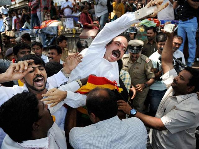 Police arrest Kannada activists during their protest over the Cauvery water issue, in Bengaluru on Thursday. (PTI) Police arrest Kannada activists during their protest over the Cauvery water issue, in Bengaluru on Thursday. (PTI)