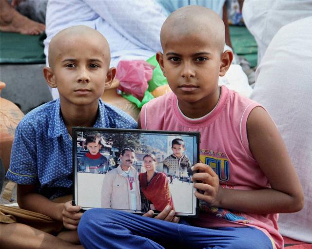 Sons of Havildar Ravi Paul who was martyred in Sunday's terrorist attack at Uri Army camp at their native village Sarwa in Samba on Monday (PTI)