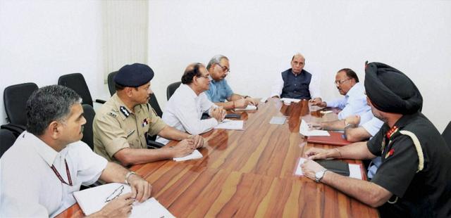 Home minister Rajnath Singh holding a high-level security meeting at his residence in New Delhi on Sunday. (PTI Photo)