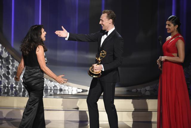 Susanne Bier, from left, accepts the award for outstanding directing for a limited series, movie or a dramatic special for The Night Manager from Tom Hiddleston and Priyanka Chopra at the 68th Primetime Emmy Awards on Sunday, Sept. 18, 2016, at the Microsoft Theater in Los Angeles. (AP)