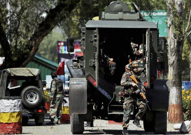 Army personnel inside the Army Brigade camp during the terror attack in Uri, Jammu and Kashmir. (PTI Photo) Army personnel inside the Army Brigade camp during the terror attack in Uri, Jammu and Kashmir. (PTI Photo)