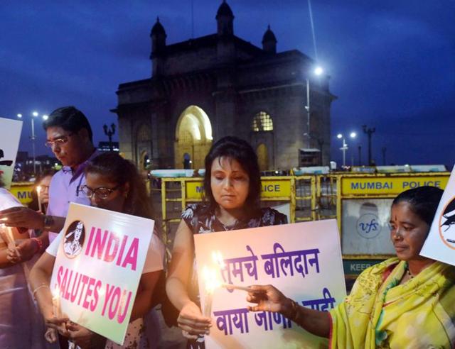 Congress party workers pay tributes to soldiers who were killed in the militant attack on the Uri army camp, in Mumbai on Monday. (PTI) Congress party workers pay tributes to soldiers who were killed in the militant attack on the Uri army camp, in Mumbai on Monday. (PTI)