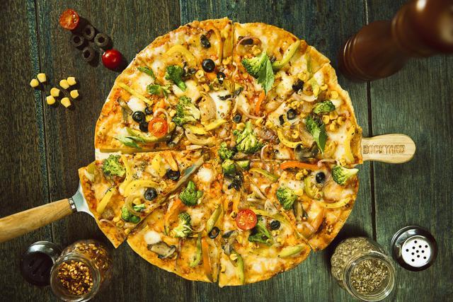 The dough for the pizza base is made with beer, and loaded with delicious toppings. The dough for the pizza base is made with beer, and loaded with delicious toppings.