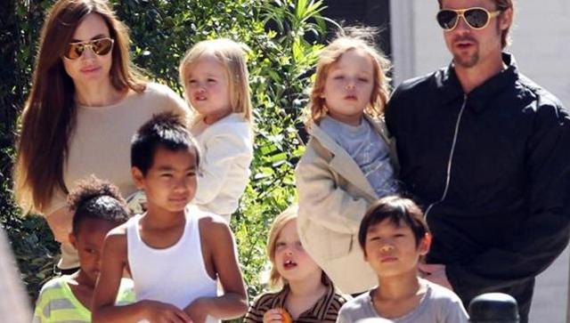 Angelina Jolie and Brad Pitt with their kids. Angelina Jolie and Brad Pitt with their kids.