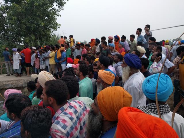 Hundreds of residents gathered at the spot before the area was cordoned off. Hundreds of residents gathered at the spot before the area was cordoned off.