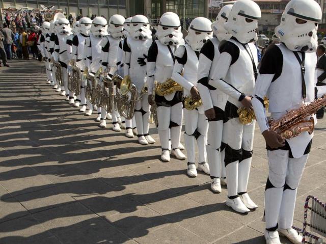 A student band dressed as storm troopers hold their instruments after playing the Star Wars song The Imperial March. (AP)