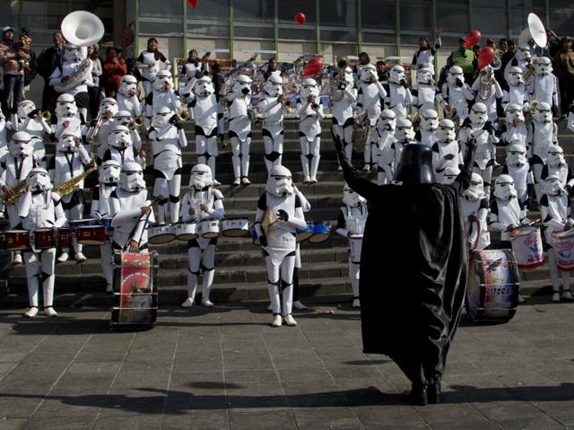 Band director Jaime Flores, dressed Darth Vader, leads his students dressed as storm troopers in the Star Wars song The Imperial March in La Paz, Bolivia. (AP)