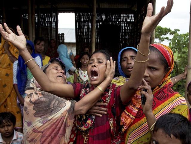 A woman carries parts of her demolished houses at Deochurchang village on the periphery of the Kaziranga National Park, Assam on September 19, 2016. (AP) A woman carries parts of her demolished houses at Deochurchang village on the periphery of the Kaziranga National Park, Assam on September 19, 2016. (AP)