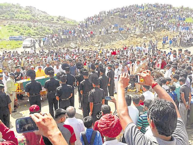 Thousands pay tributes to soldier Nimbh Singh Rawat at Rajwa village in Rajsamand district on Tuesday. (HT Photo) Thousands pay tributes to soldier Nimbh Singh Rawat at Rajwa village in Rajsamand district on Tuesday. (HT Photo)