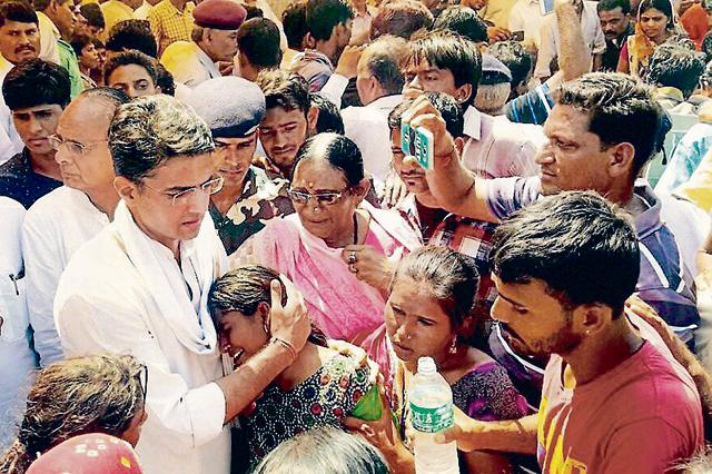 Congress leader Sachin Pilot consoles the family members of Nimbh Singh Rawat who was martyred in Uri Attack, during his cremation in Rajwa village of Rajsamand on Tuesday. (PTI Photo) Congress leader Sachin Pilot consoles the family members of Nimbh Singh Rawat who was martyred in Uri Attack, during his cremation in Rajwa village of Rajsamand on Tuesday. (PTI Photo)