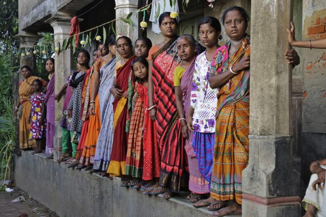 Villagers of Jamuna Balia in west Kolkata wait on a verandah to witness the funeral procession of soldier Gangadhar Dalai, who was killed in a militant attack in Uri, Kashmir. (AP) Villagers of Jamuna Balia in west Kolkata wait on a verandah to witness the funeral procession of soldier Gangadhar Dalai, who was killed in a militant attack in Uri, Kashmir. (AP)