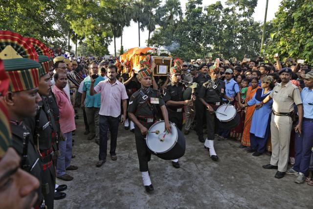 An Indian army band leads the funeral procession of Indian army soldier Gangadhar Dalai, who was killed in a militant attack in Uri, Kashmir. (AP) An Indian army band leads the funeral procession of Indian army soldier Gangadhar Dalai, who was killed in a militant attack in Uri, Kashmir. (AP)
