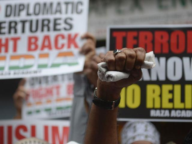 A man raises his fist in air while protesting in Mumbai on Tuesday following a militant attack at the Uri army base.(AFP) A man raises his fist in air while protesting in Mumbai on Tuesday following a militant attack at the Uri army base.(AFP)