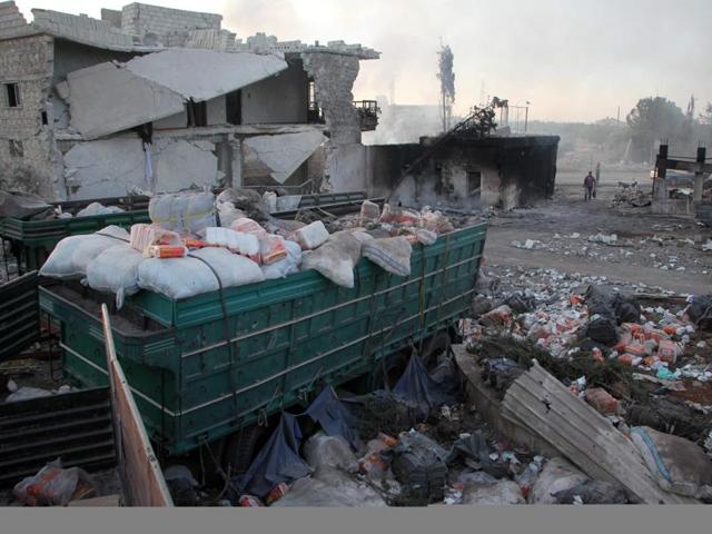 Aid is seen strewn across the floor in the town of Orum al-Kubra on the western outskirts of the northern Syrian city of Aleppo on September 20, 2016, the morning after a convoy delivering aid was hit by a deadly air strike.(AFP) Aid is seen strewn across the floor in the town of Orum al-Kubra on the western outskirts of the northern Syrian city of Aleppo on September 20, 2016, the morning after a convoy delivering aid was hit by a deadly air strike.(AFP)