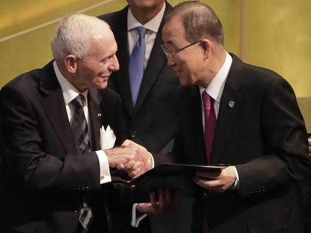 United Nations secretary-general Ban Ki-moon, right, shakes hands with William Lacy Swing, director general of the International Organisation for Migration, after signing documents during the opening of a summit to address large movements of refugees and migrants at UN headquarters on Monday. (AP) United Nations secretary-general Ban Ki-moon, right, shakes hands with William Lacy Swing, director general of the International Organisation for Migration, after signing documents during the opening of a summit to address large movements of refugees and migrants at UN headquarters on Monday. (AP)