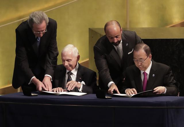 United Nations secretary-general Ban Ki-moon, right, signs documents with William Lacy Swing, director general of the International Organisation for Migration, during the opening of a summit to address large movements of refugees and migrants at UN headquarters on Monday. (AP) United Nations secretary-general Ban Ki-moon, right, signs documents with William Lacy Swing, director general of the International Organisation for Migration, during the opening of a summit to address large movements of refugees and migrants at UN headquarters on Monday. (AP)