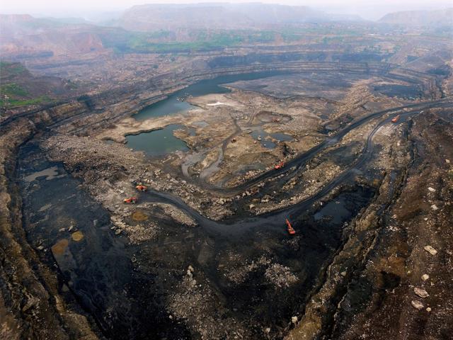 Dhasar open cast mines is seen in Dhanbad. (PTI) Dhasar open cast mines is seen in Dhanbad. (PTI)