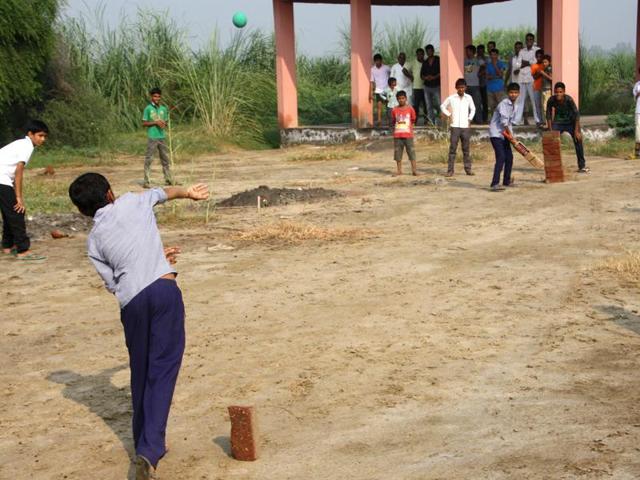 A cricket match in progress at the cremation ground in Khrari village of Rohtak district.(Manoj Dhaka/HT Photo) A cricket match in progress at the cremation ground in Khrari village of Rohtak district.(Manoj Dhaka/HT Photo)